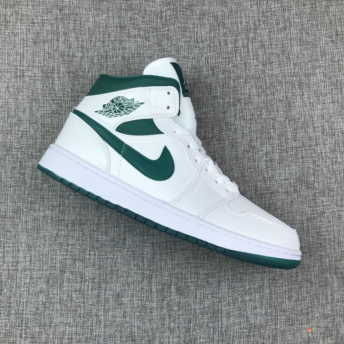 Single side view highlighting the green Swoosh and winged basketball emblem.