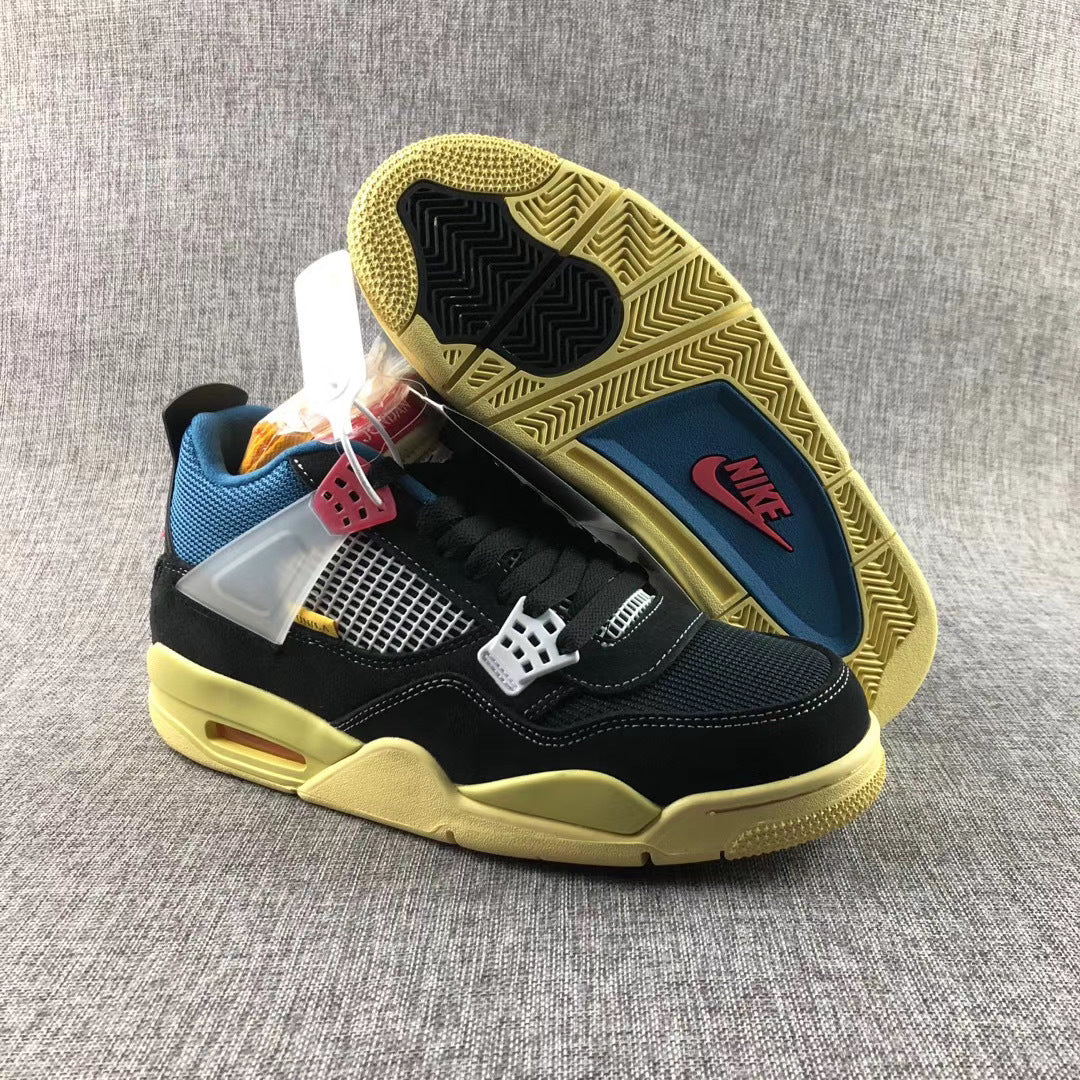 Sneaker angled to show the patterned yellow-toned outsole, black traction sections, and blue insole area.