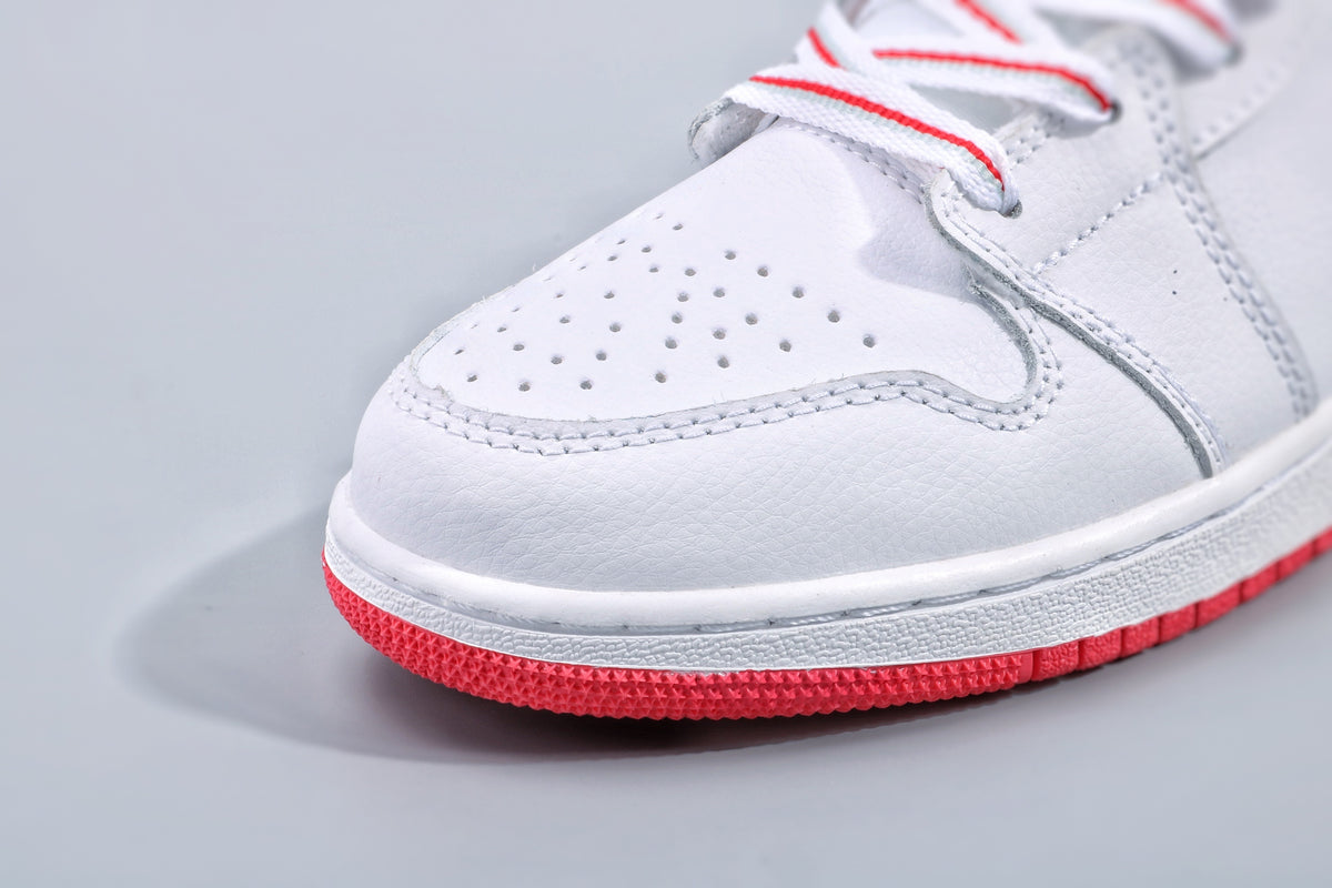 Close-up of the perforated white toe box and red rubber outsole.