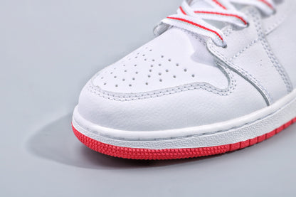 Close-up of the perforated white toe box and red rubber outsole.