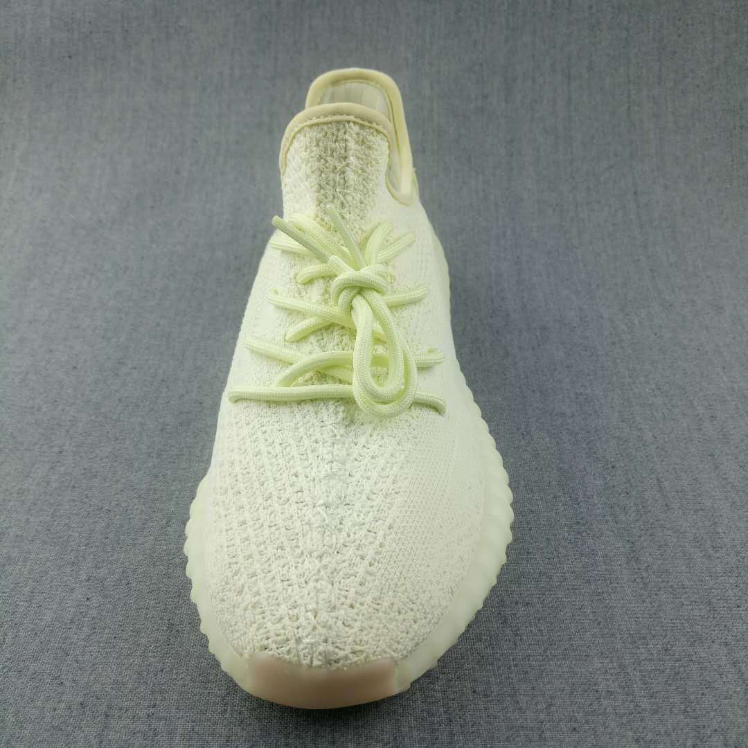 Top view showing the lace arrangement, textured toe box, and rounded sneaker shape.