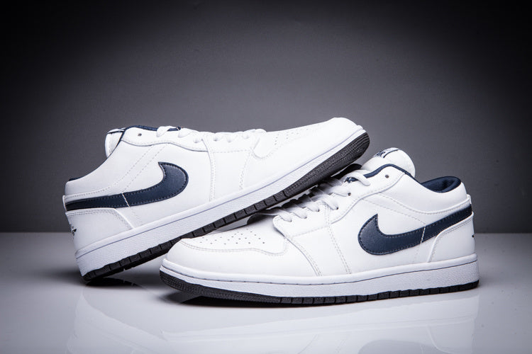 Pair of white low-top Jordan sneakers shown from the side and front three-quarter angles.