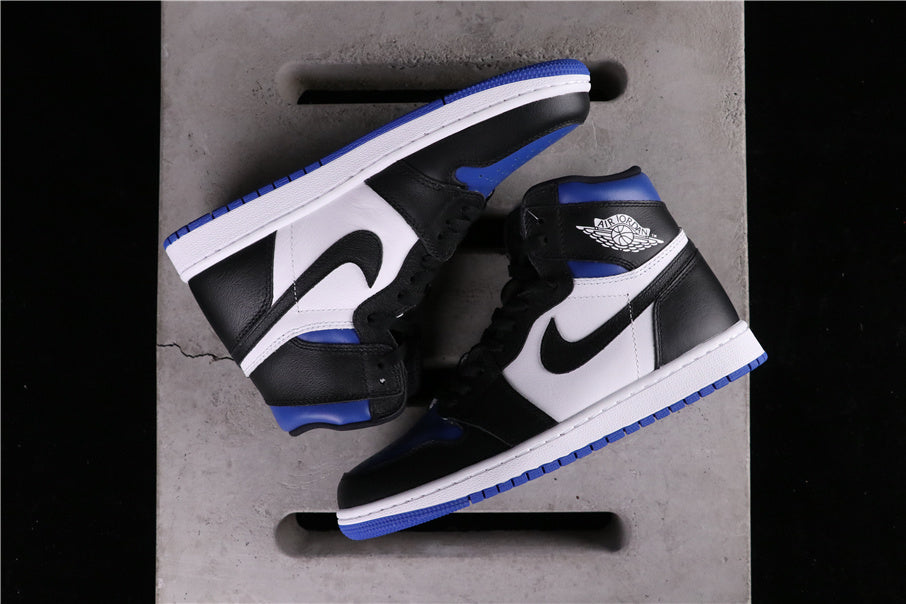 Overhead view of a pair of black, white and blue high-top sneakers.