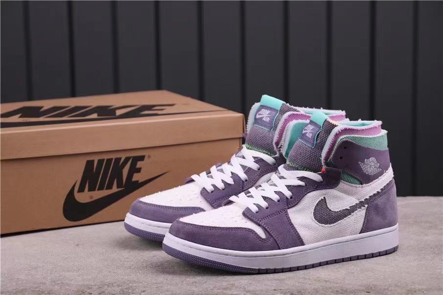 Pair of high-top sneakers shown from a front three-quarter angle in lavender, white, teal and pink.