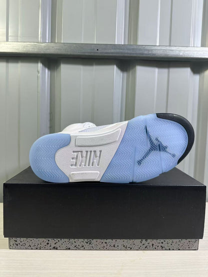 Outsole view showing translucent blue sections, black traction accents, and Nike branding.
