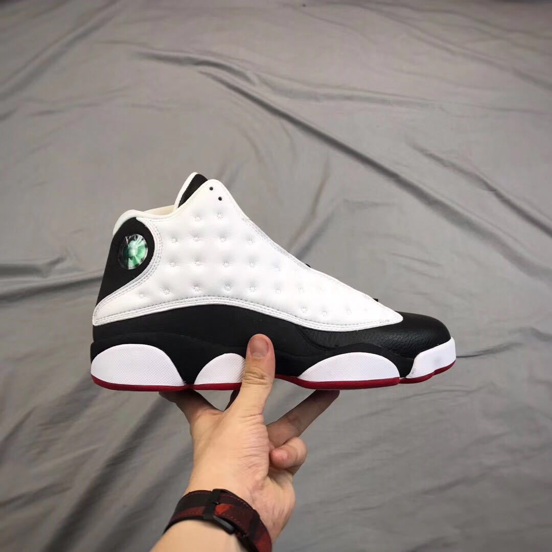 Side profile of one sneaker highlighting the perforated white panel and segmented white outsole sections.