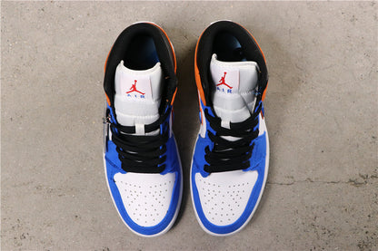 Top view of the blue, white and black mid-top sneakers with orange details, black laces and perforated toe boxes.