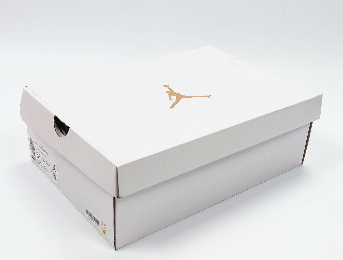 White Jordan shoe box with a gold Jumpman logo and a visible size label area.