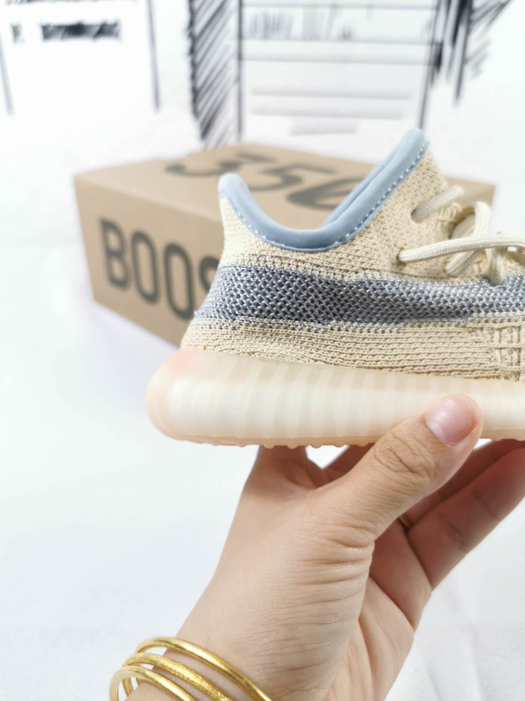 Side and heel detail showing the gray stripe, padded collar, and translucent ribbed outsole.