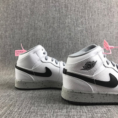 Close three-quarter view of the pair highlighting the black Swoosh, winged ankle branding, and grey laces.
