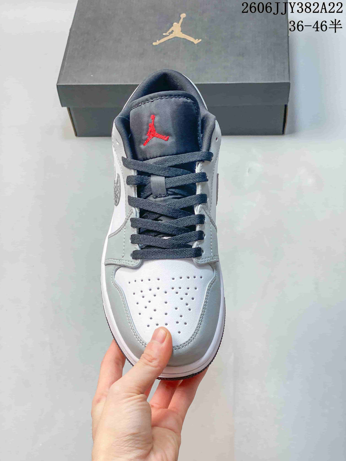 Jordan Air Jordan 1 Low Sneakers in White and Grey