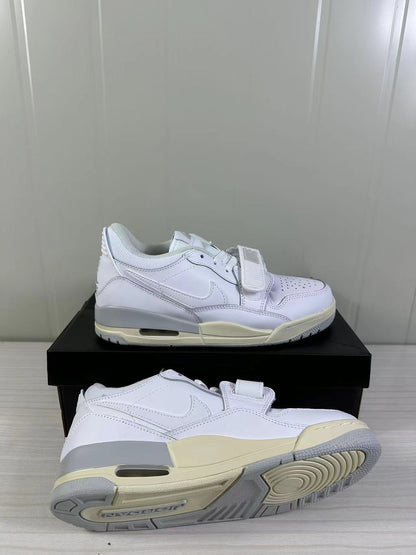 Two white sneakers displayed from side and outsole angles, highlighting the layered construction and traction pattern.