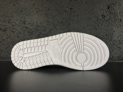 Close-up of the white rubber outsole showing circular forefoot traction and segmented tread blocks.