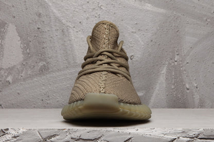 Front view showing the rounded toe, lace-up design and textured woven upper.