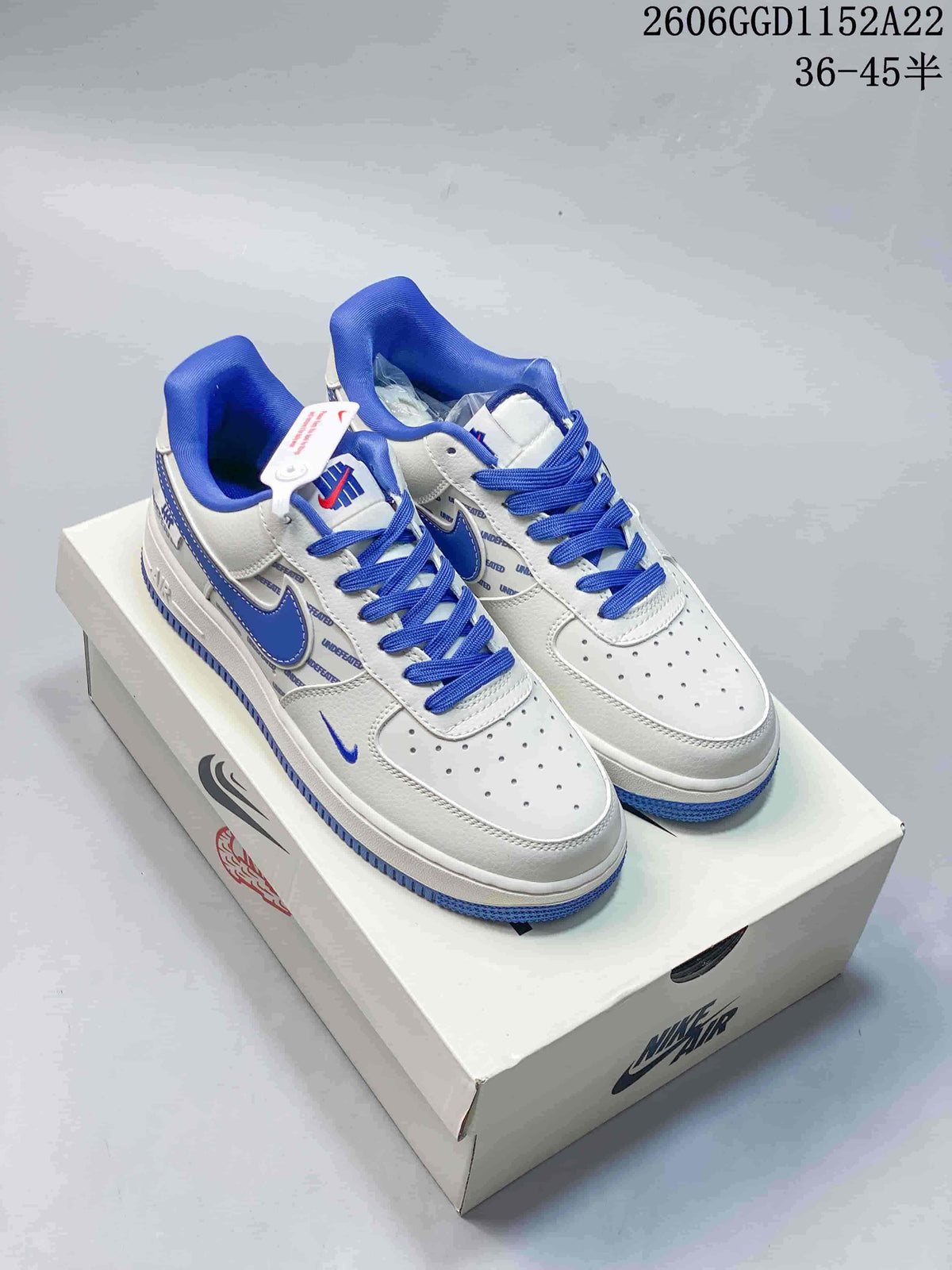 Nike Air Force 1 Low Sneakers in White, Gray, and Blue