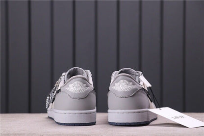 Rear view of the pair showing grey heel panels, white midsoles and dark translucent outsole edges.