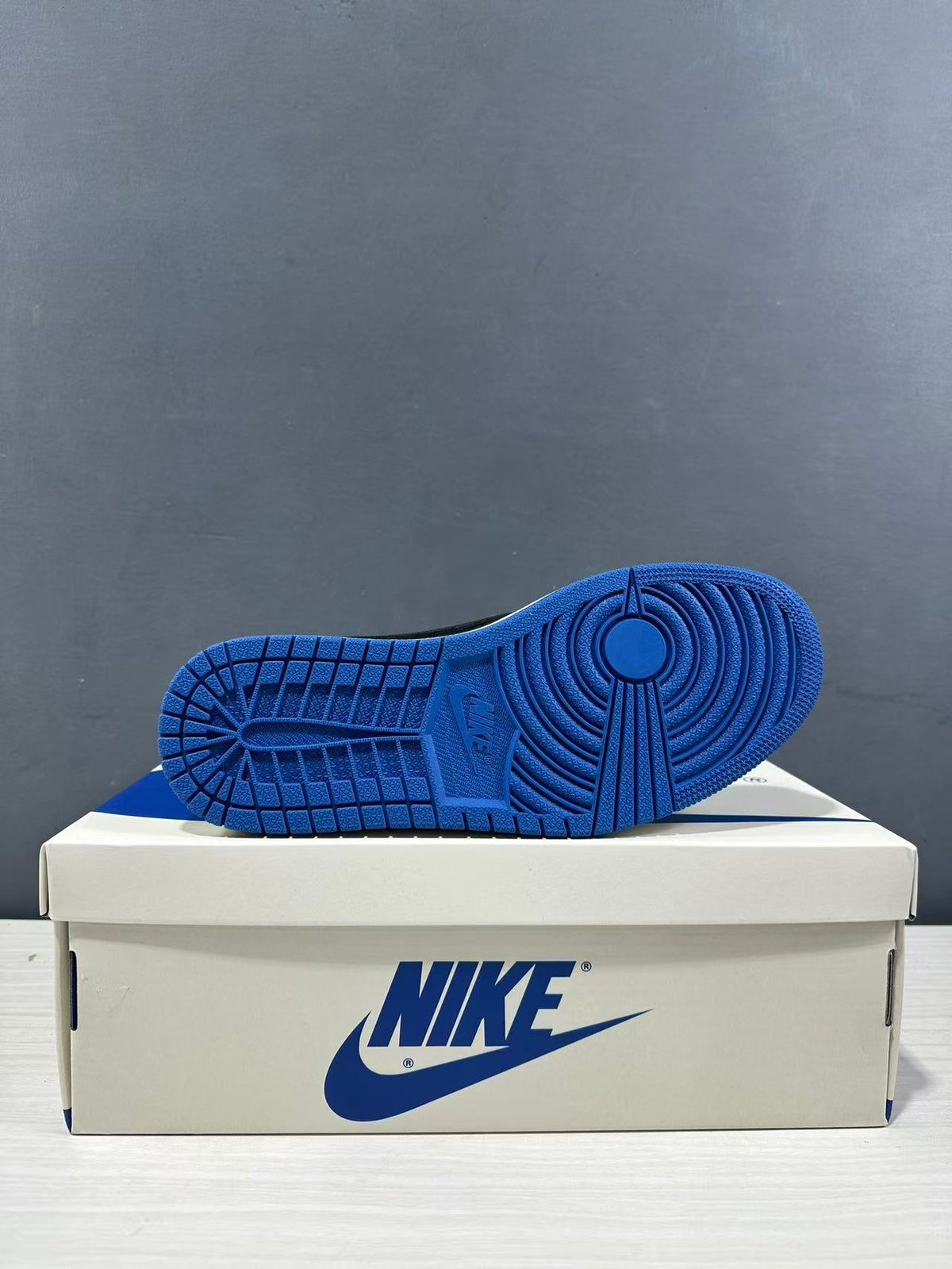 Outsole view showing the blue rubber traction pattern and circular pivot-point design.