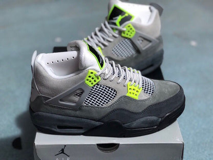 Side view of the grey high-top sneakers showing mesh panels, lace wings, and black cushioning details.