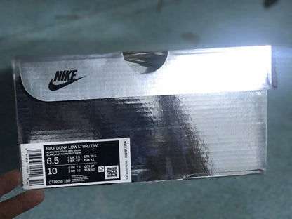 Nike sneaker box label showing Dunk Low LTHR / OW, color information, style code CT0856-100, and sample sizes.