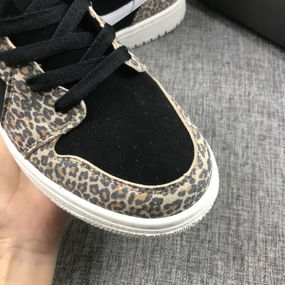 Close-up of the black perforated toe box, black laces, and leopard-print eyestay and toe overlay.