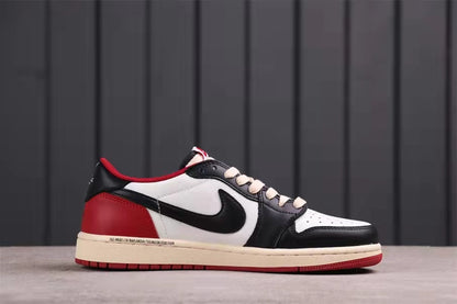 Side profile showing the black and white upper, black Swoosh, red heel, and cream midsole.
