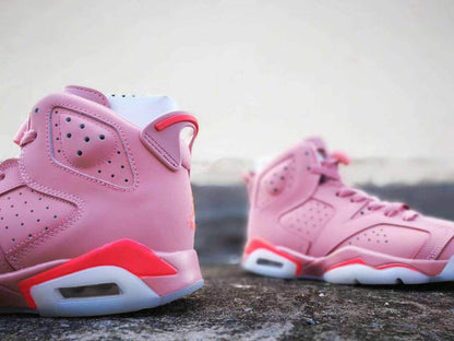 Close-up side view highlighting the perforated collar, heel pull tab, and visible cushioning window.