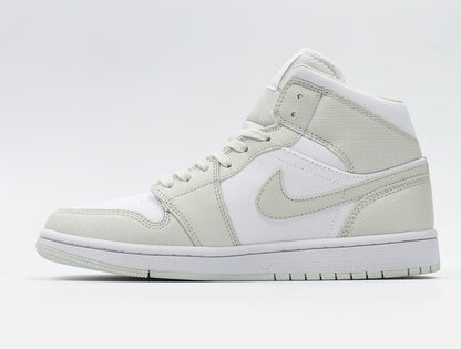 Side profile showing the high-top collar, Swoosh, layered panels, and white midsole.