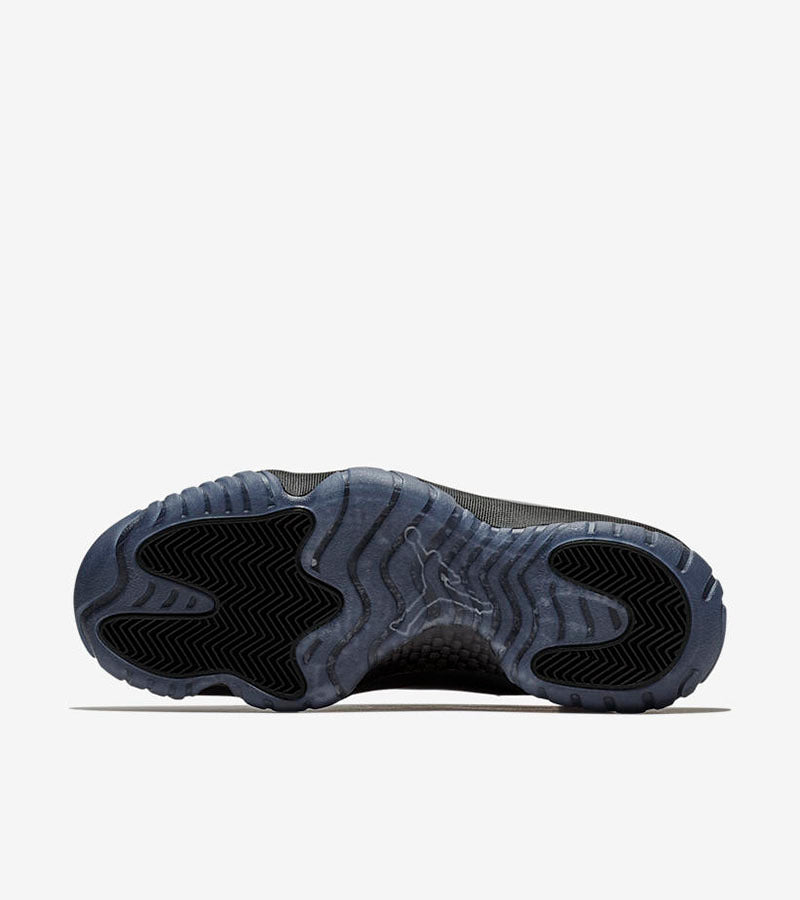 Studio outsole view showing black traction sections and a translucent blue-gray base.