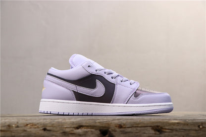 Side profile of the low-top sneaker showing the light purple upper, dark side panel, Swoosh, and white sole.