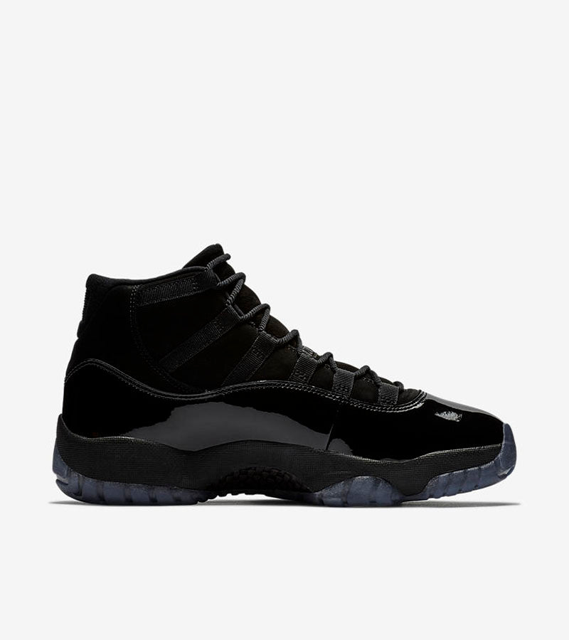 Studio side profile of a black high-top sneaker on a white background.