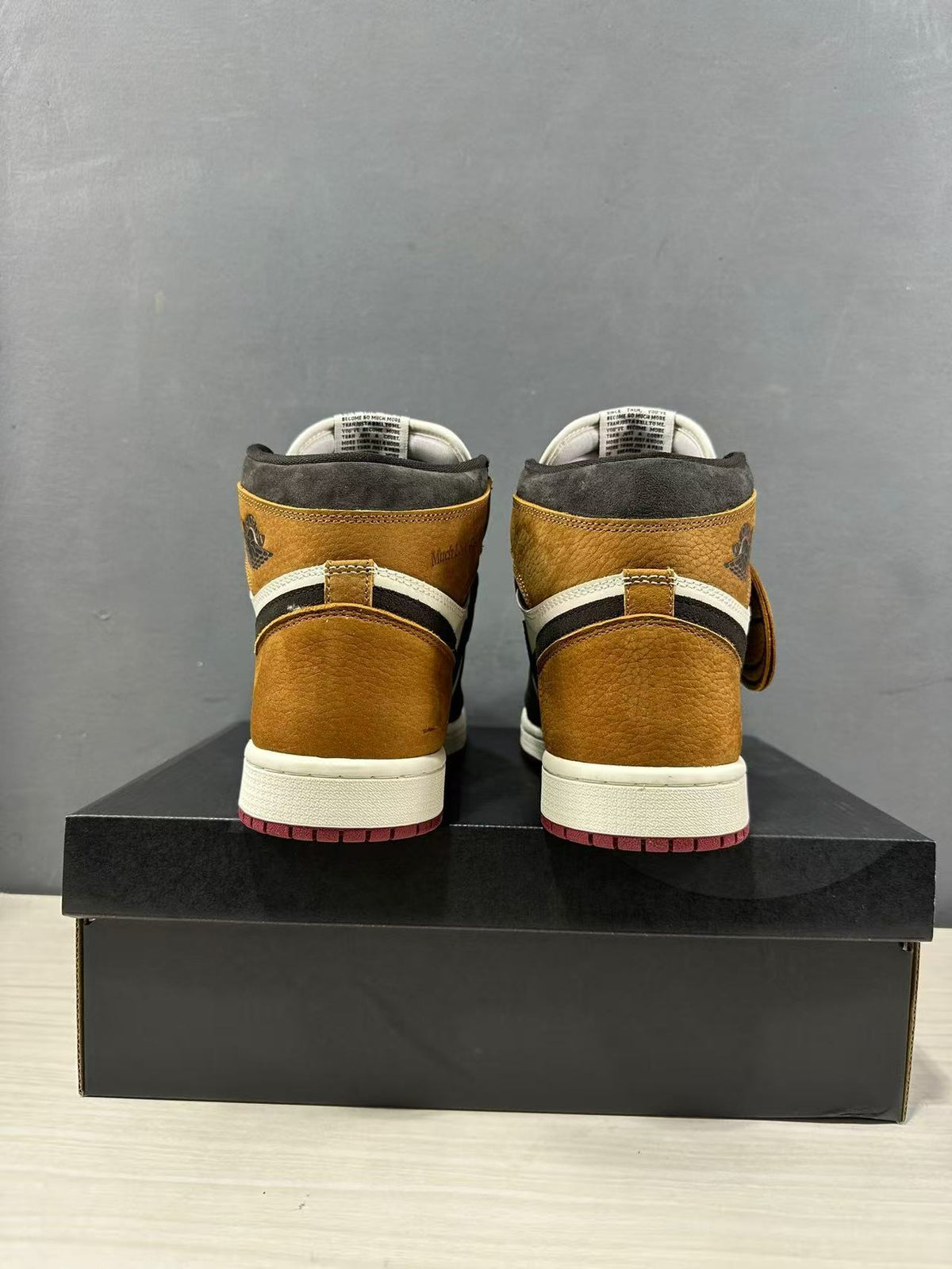 Rear view of the pair showing matching brown heel panels and black-and-white collar details.