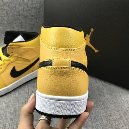 Close rear view of the yellow high-top sneaker showing stitching, ankle padding, and the white midsole.
