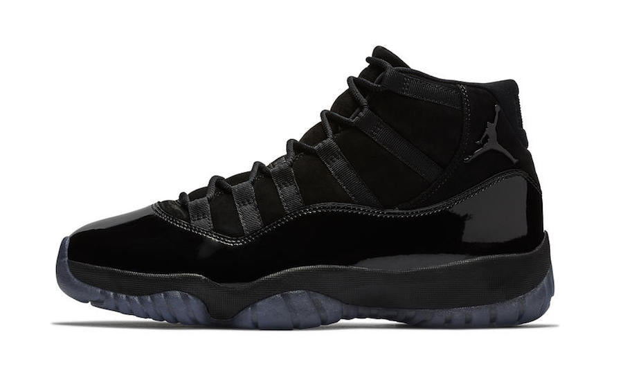 Studio side profile of a black high-top sneaker on a white background.
