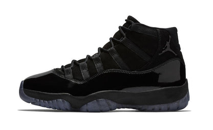 Studio side profile of a black high-top sneaker on a white background.