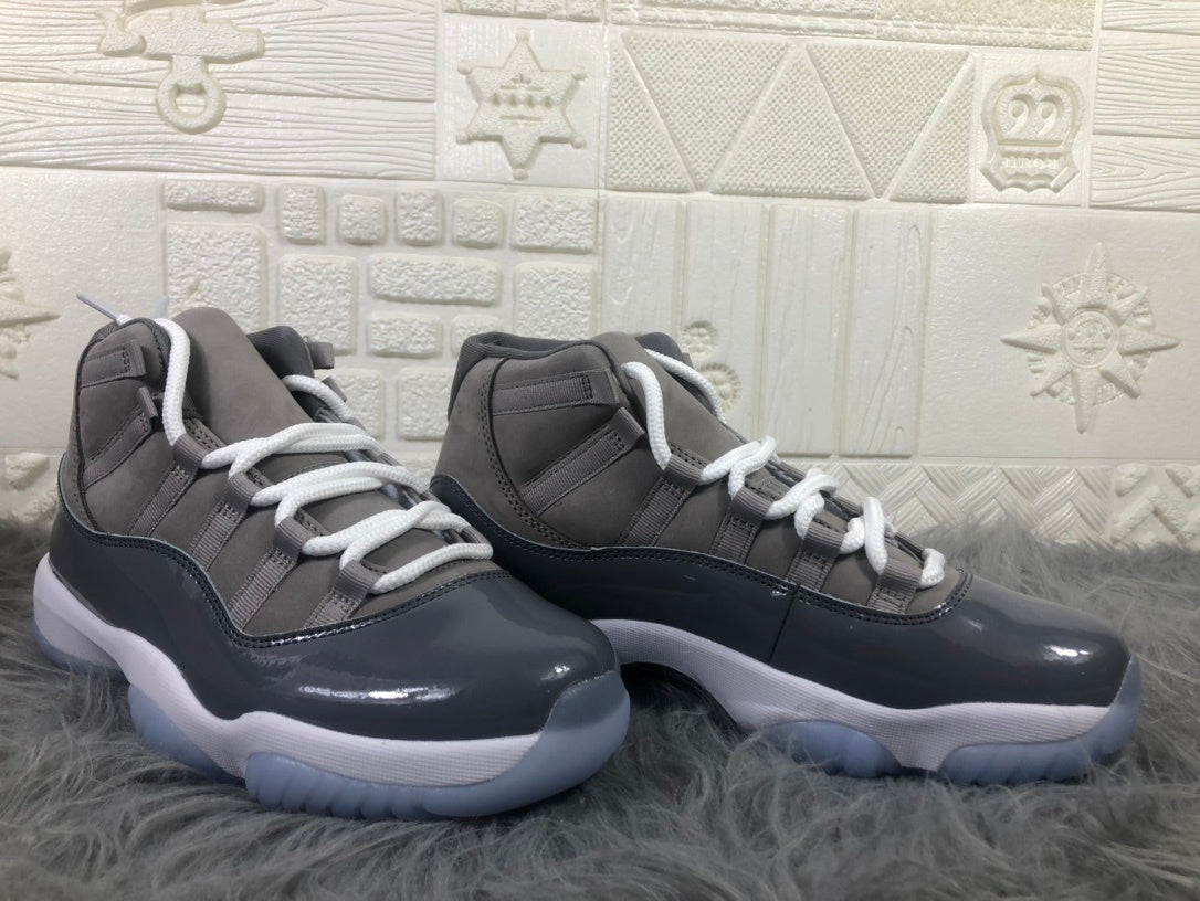 Pair of cool grey and black high-top sneakers shown from the side with white laces and white midsoles.