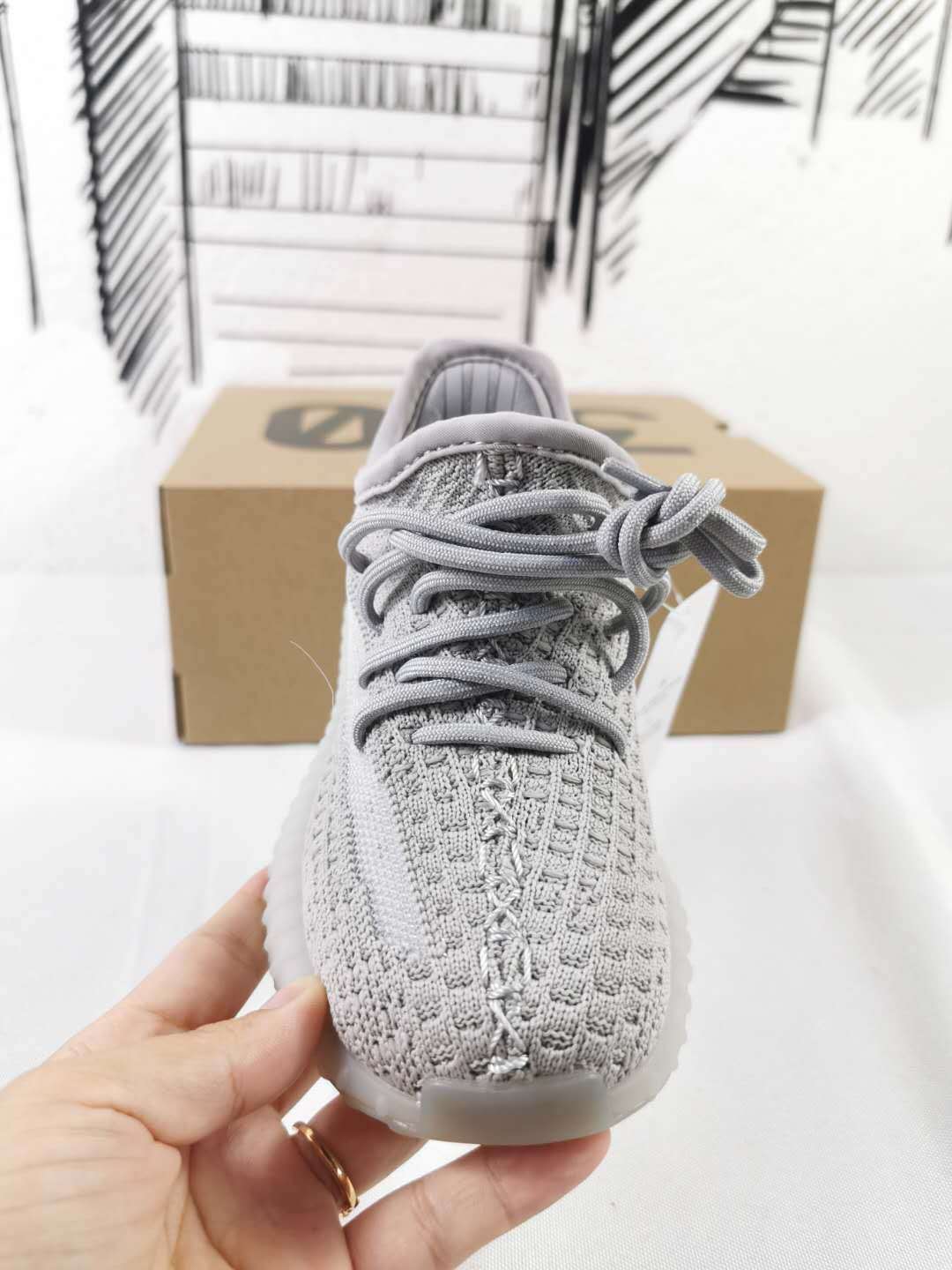 Front view showing the gray laces and textured knit-style upper.