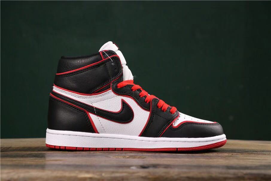 Side profile of a high-top sneaker showing black and white panels, a black Swoosh-style mark, red trim, and a white midsole.