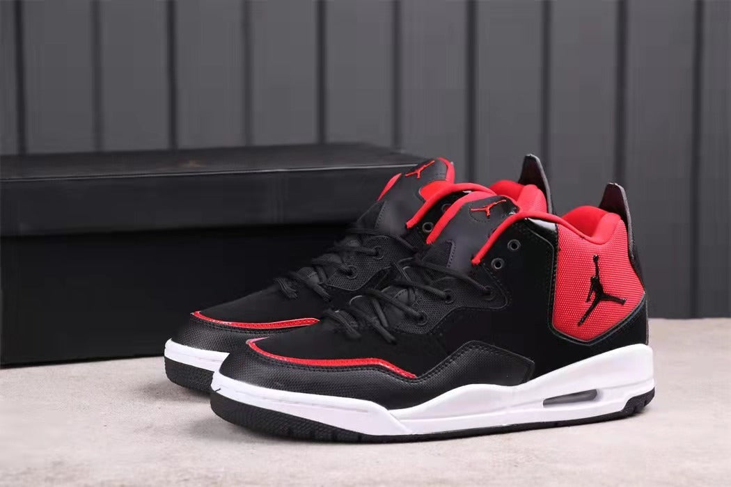 Pair of black high-top basketball sneakers with red accents and white midsoles.