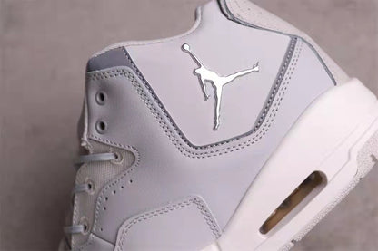 Close-up of the side panel, metallic Jumpman logo, stitching, and visible sole window.