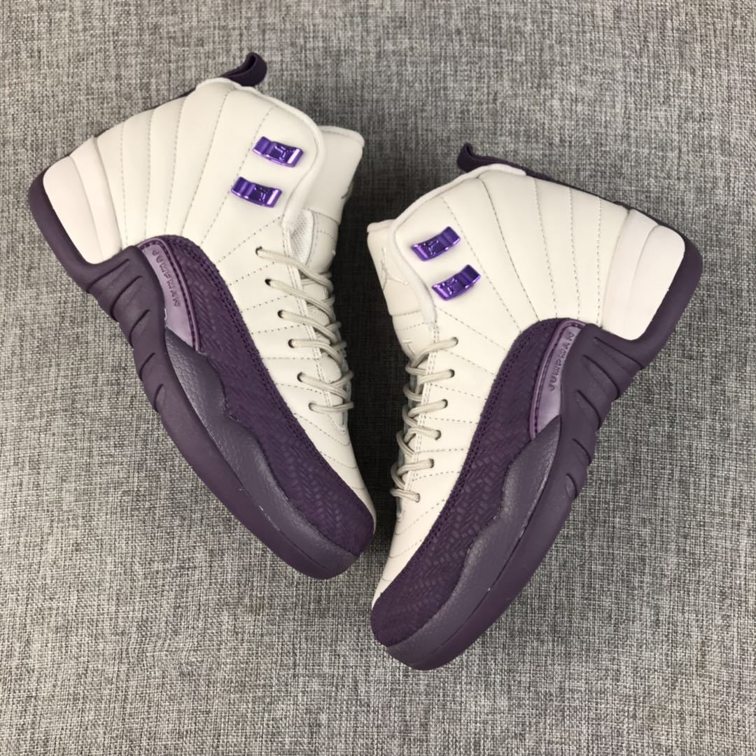 Pair of off-white and purple Air Jordan 12 sneakers viewed from above