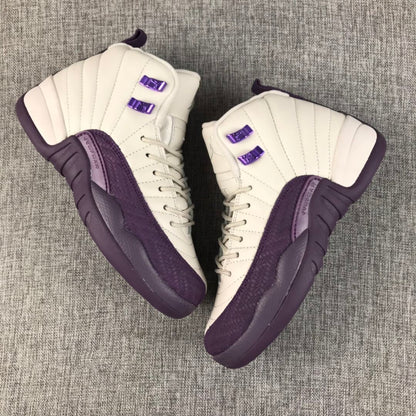 Pair of off-white and purple Air Jordan 12 sneakers viewed from above