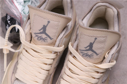Close-up of the tongues showing Jumpman-style graphics, printed lettering, cream laces, and padded collars.