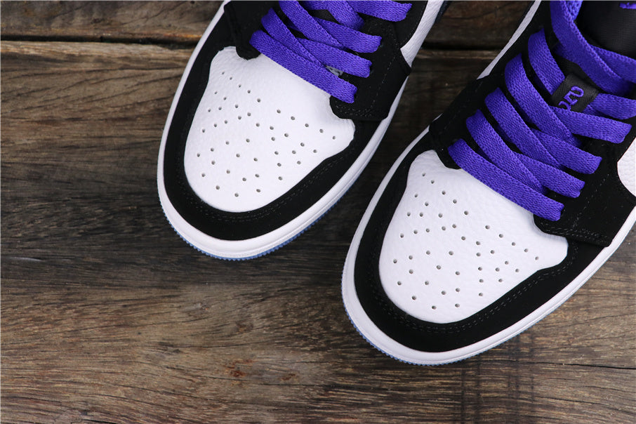 Top view showing purple laces, perforated white toe panels, and black overlays