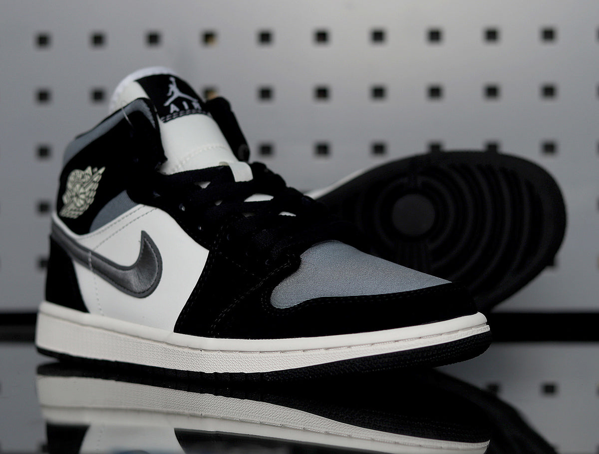 Front three-quarter view of one sneaker beside its black rubber outsole.