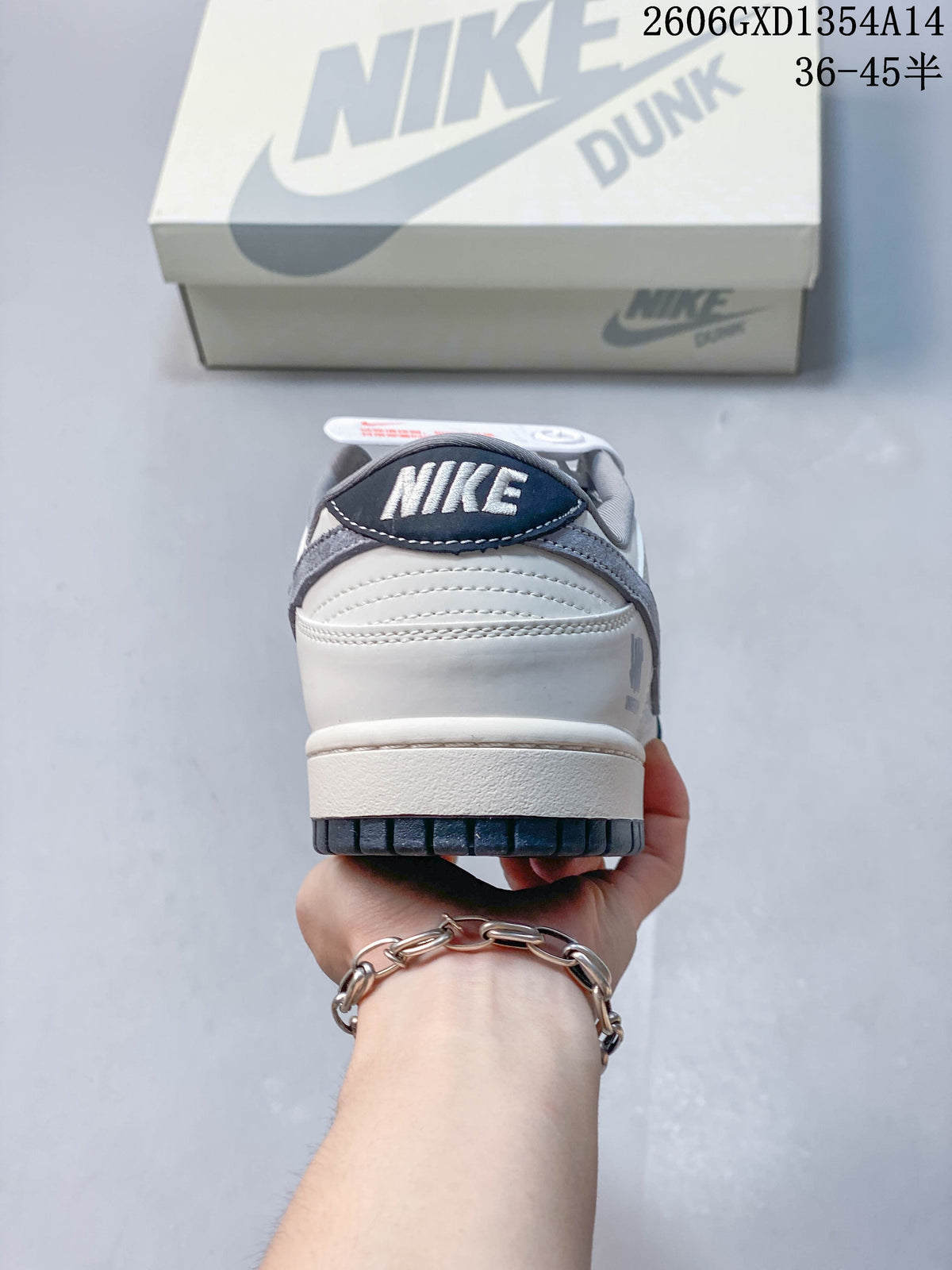 Nike Dunk Low x Undefeated Sneakers in White and Navy