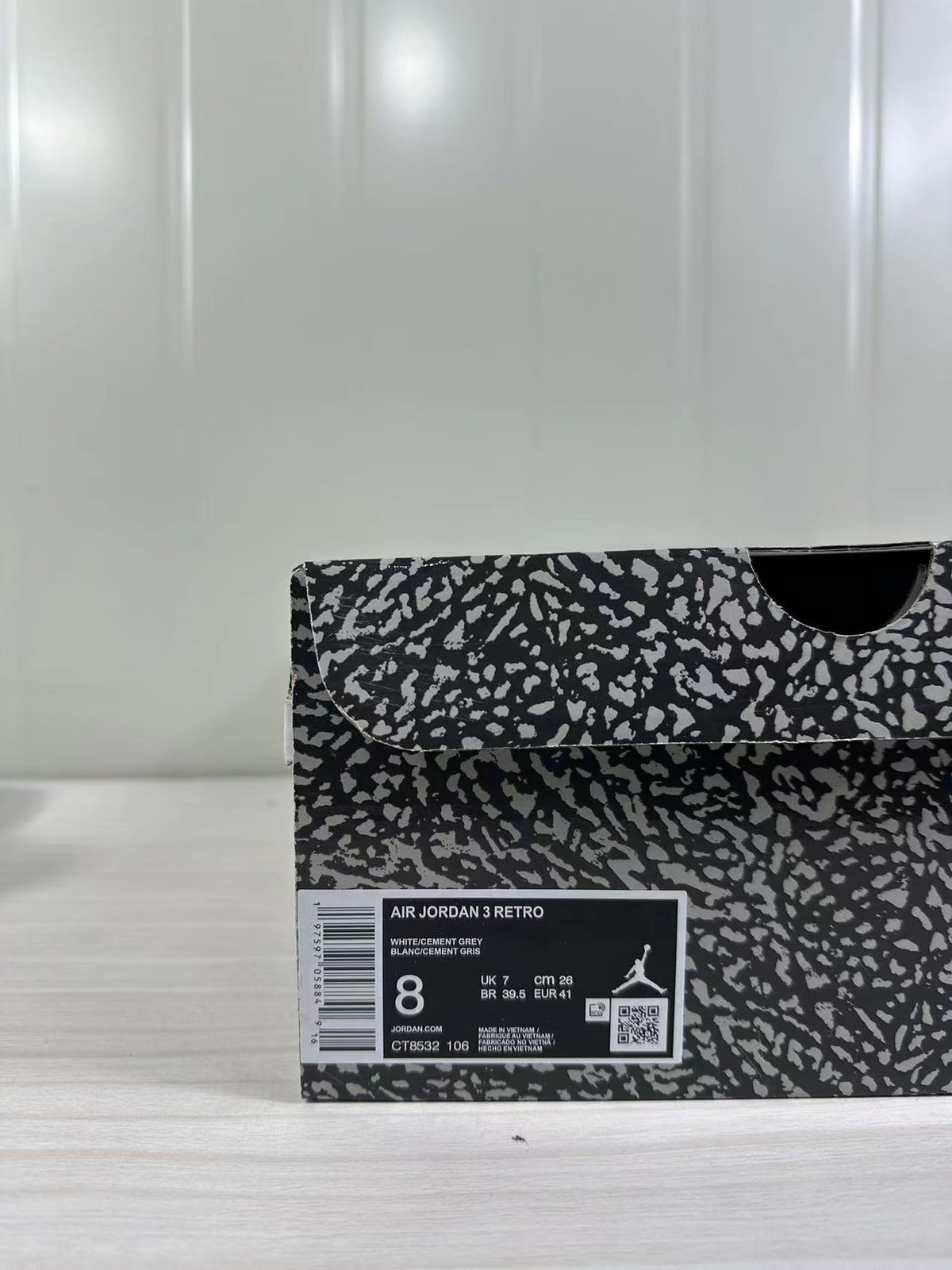 Shoebox label reading AIR JORDAN 3 RETRO, WHITE/CEMENT GREY, style CT8532 106, with a photographed EU 41 sample size.