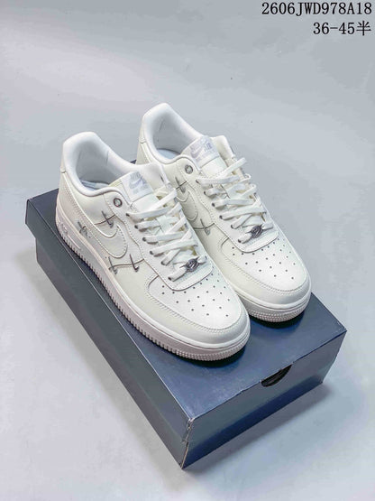 Nike Air Force 1 Low White Sneakers with Metallic Accents