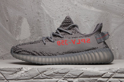 Profile view highlighting the dark grey upper, black patterning, red side lettering and translucent outsole.