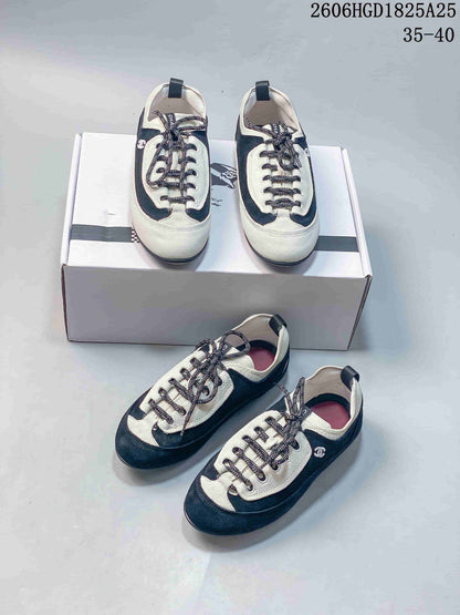 Chanel Two-Tone Low-Top Trainer in Black and Ivory