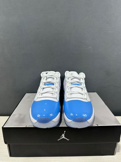 Front view of the pair showing white laces, blue toe panels, and low-top collars.